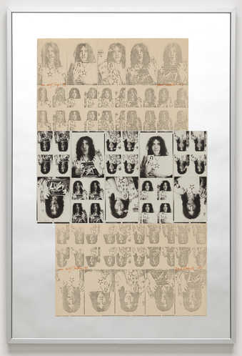 Black and white photographs of the artist attached across the center of a mirror and photo copies...