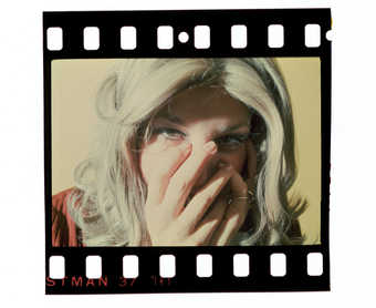 Unmounted slide of Roberta with hands over face.