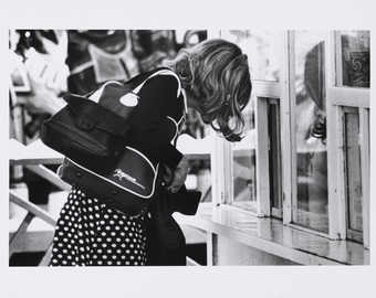 Roberta hunched over a counter.