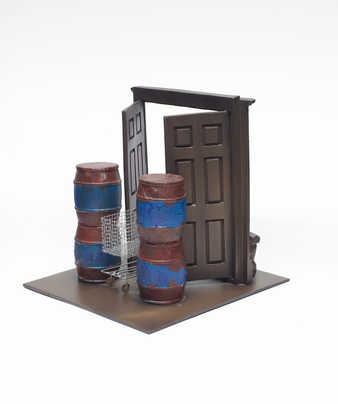 A model scaled, double-door, doorway in which the doors are held open by a shopping cart.