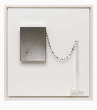 A glass hammer attached with a chain to a steel plate pierced by nail.