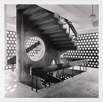 A black and white image of an exterior staircase on a modernist Indian building.