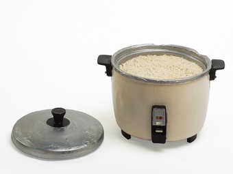 A resin rice cooker with detachable lid.