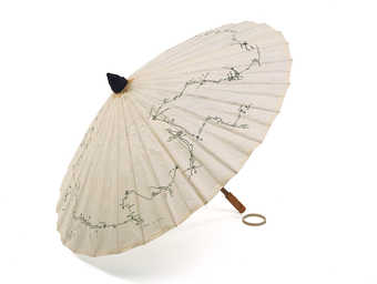 A wood and paper parasol made by the artist.  Printed in black ink on top of parasol is the route...