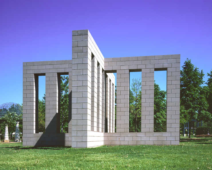 X-shaped cinderblock construction permanently installed in the sculpture garden