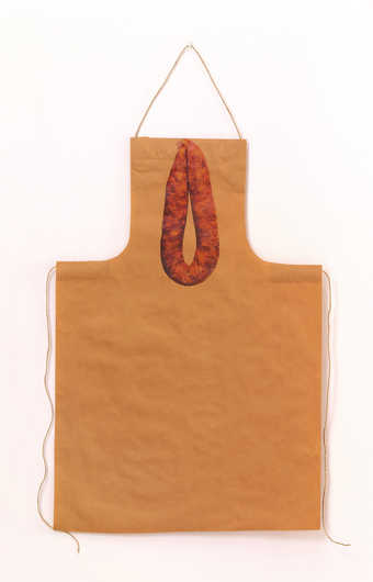 An apron made from brown wrapping paper with iron-on image of a sausage, comes with a recipe for...