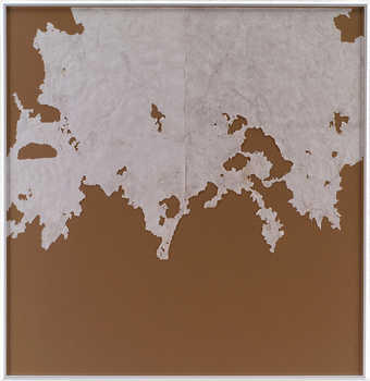 paper that has been partially eaten by snails mounted to brown board.  The works are installed...