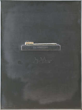 An image of a tooth brush with teeth bristles on a small pedestal embossed in lead.