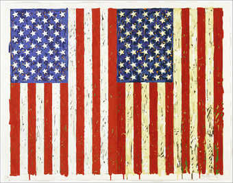 An image of two U.S. flags vertical in orientation side by side.  The left image is red, white...