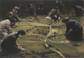 An image of a group of women woring on a landscape model