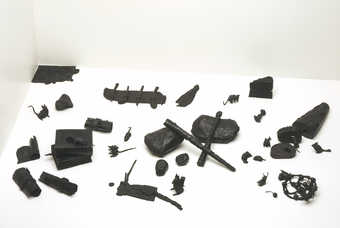 Cast bronze mice and objects.