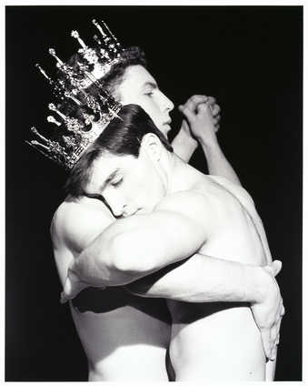 A torso view of two shirtless men wearing crowns, dancing. From a 2-1/4" negative, catalog...