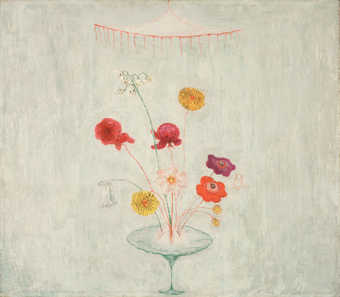 flowers in a vase under a light. white background