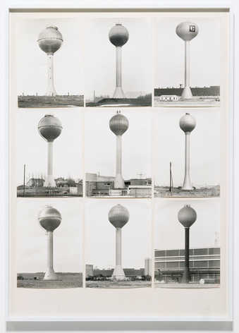 nine black-and-white images of watertowers mounted on white paperboard