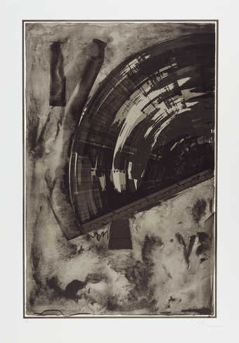 An image of a ruler that has been scraped against a black field creating a semi circle, ending at...