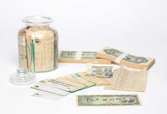 Bundles of Zero-Yen notes and a lidded jar containing correspondence and currency sent to the...
