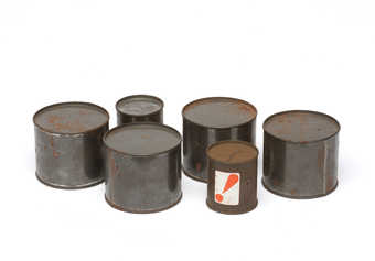Sealed cans containing unknown objects.  Relics of a 1964 action.