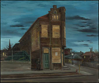 deserted building with house in background