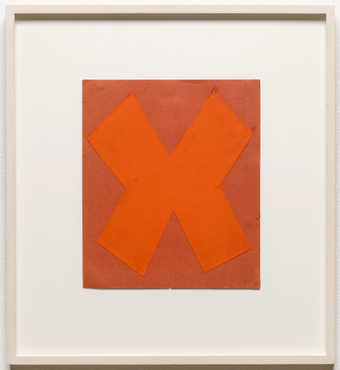 A orange "X" shaped piece of paper adhered to a lighter orange paper support.  A study...