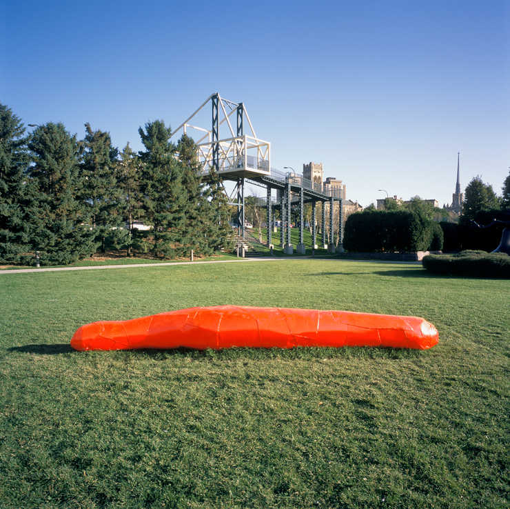 A large dayglow orange pickle-like form.