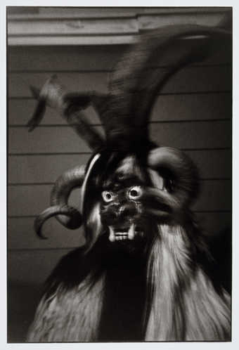 An image of a man wearing a Kranky Klaus mask